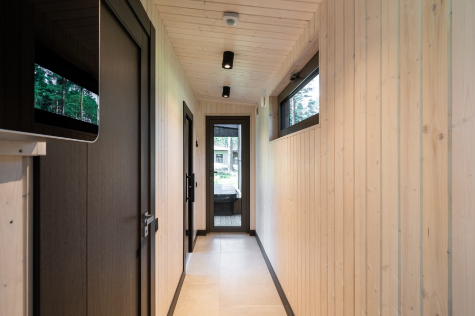 Insulated sauna house with a burnt wood  cladding