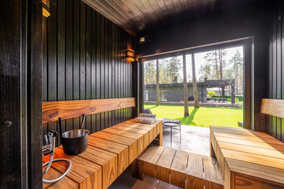 Insulated sauna house with a burnt wood  cladding