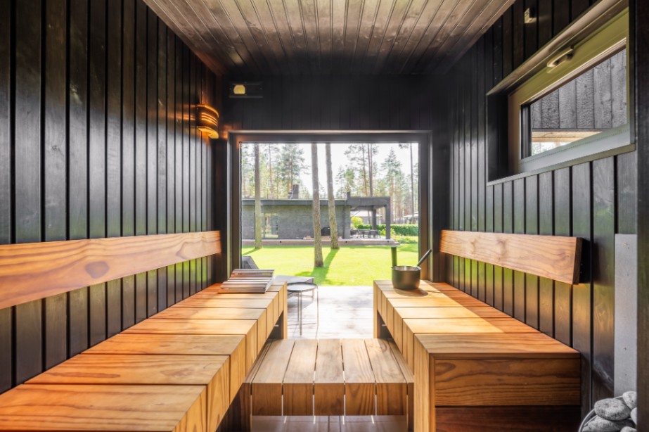 Insulated sauna house with a burnt wood  cladding