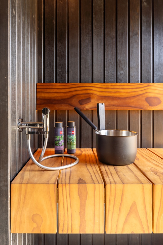 Insulated sauna house with a burnt wood  cladding