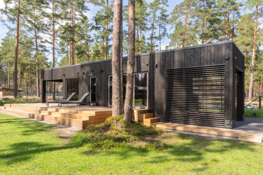 Insulated sauna house with a burnt wood  cladding