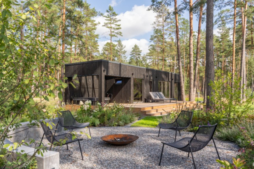 Insulated sauna house with a burnt wood  cladding