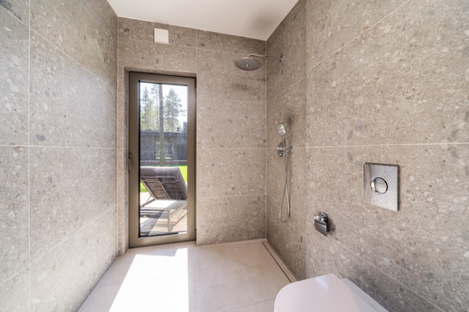 Insulated sauna house with a burnt wood  cladding