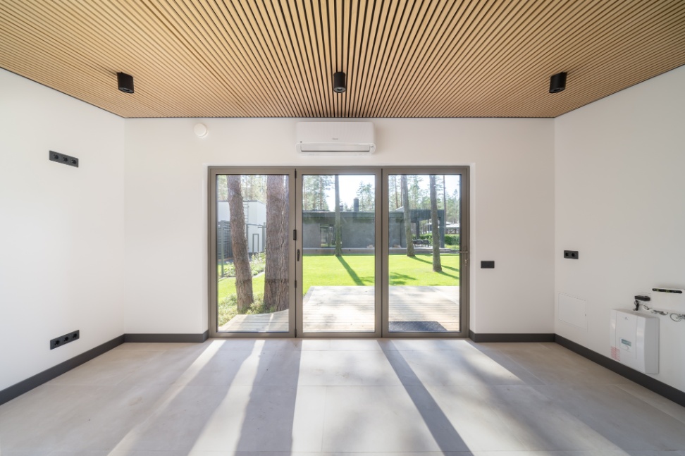 Insulated sauna house with a burnt wood  cladding
