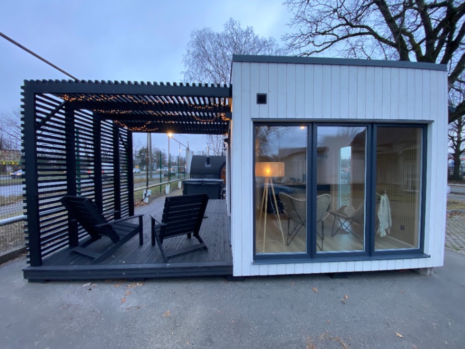 attēls, kurā attēlota koka moduļu māja